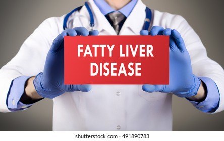 Doctor's hands in blue gloves shows the word fatty liver disease. Medical concept.