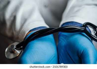 Doctor's Hands Tied With A Stethoscope