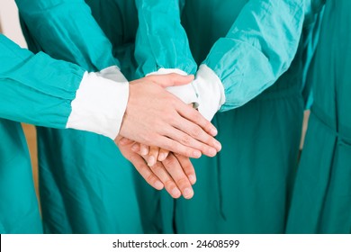 Doctors With Hands Together To Form A Medical Teamwork