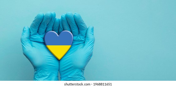 Doctors Hands Wearing Surgical Gloves Holding Ukraine Flag Heart