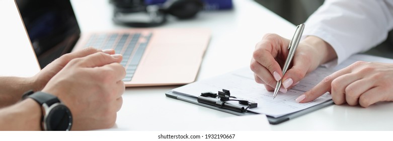 Doctors hands writing down patients complaints in medical history closeup. Medical consultation concept - Shutterstock ID 1932190667