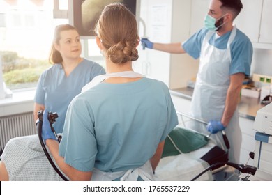 Doctors In Internal Department Of Hospital Performing Endoscopy In Surgery