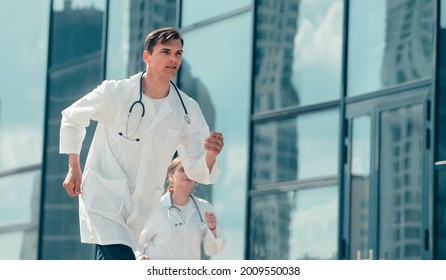 Doctors Interns Running On A Call To The Patient.