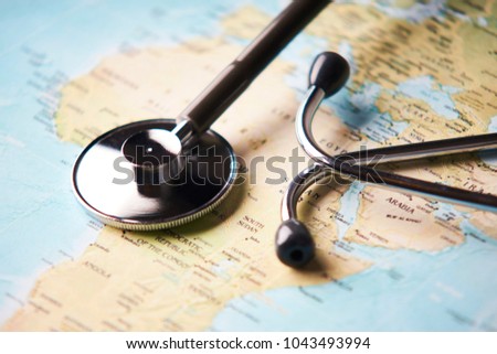 Doctor's medical stethoscope over africa healthcheck. Medical concept tourism travel care diseases healthy, close-up. Selective focus