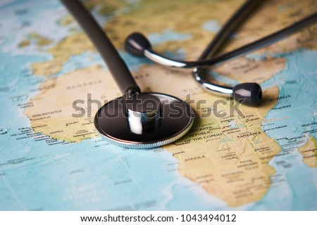 Doctor's medical stethoscope over africa healthcheck. Medical concept tourism travel care diseases healthy, close-up. Selective focus