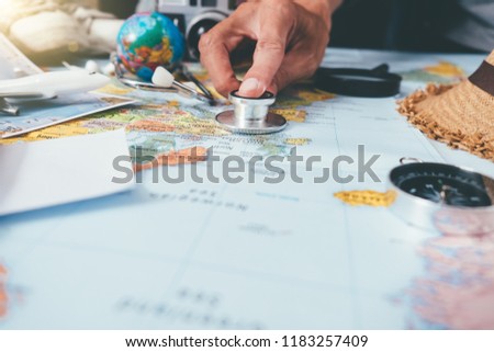 Doctor's medical stethoscope over healthcheck. Medical concept tourism travel care diseases healthy, close-up. Selective focus