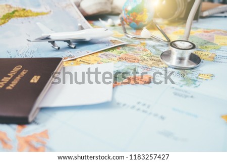 Doctor's medical stethoscope over healthcheck. Medical concept tourism travel care diseases healthy, close-up. Selective focus