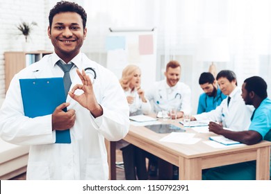 Doctors Meeting. Diagnostic Discussion. Multinational Medicals. Professional Consultation. Patient's Test Results. Indian Specialist Smile. Clinician Team Group. Physician Assistants.