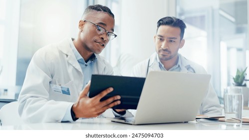 Doctors, meeting and men in hospital with tablet for discussion, treatment plan or diagnosis. Talking, healthcare and medical professionals with laptop for conversation, teamwork or collaboration - Powered by Shutterstock