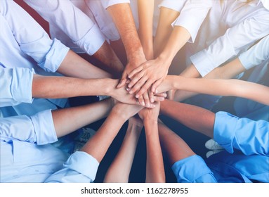 Doctors and nurses coordinate hands - Shutterstock ID 1162278955