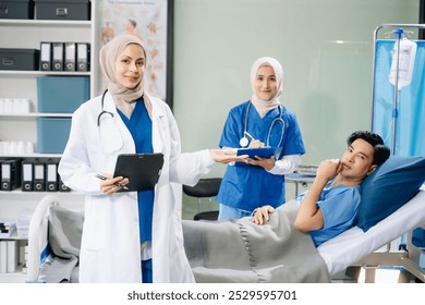 Doctors and nurses in hijabs offering care to a patient in a hospital ward, showcasing teamwork, professionalism, and a compassionate healthcare environment. - Powered by Shutterstock