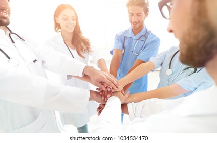 Doctors And Nurses In A Medical Team Stacking Hands