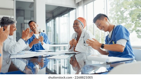 Doctors, nurses and meeting with documents in hospital discussing medical records. Teamwork, planning and group of healthcare professionals, men and women with paperwork talking in training workshop. - Powered by Shutterstock