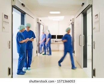 Doctors And Nurses In Scrubs In Hospital, Blurred Motion