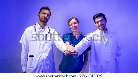 Doctors and nurses stacking hands together. Portrait of Professional Healthcare staff Team. Male and female Doctor and nurses medicals staff. Professionalism successful teamwork and Unity