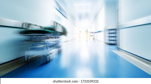 Doctors Or Nurses Walking In Hospital Hallway, Blurred Motion.