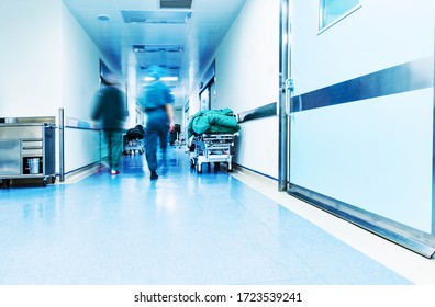 Doctors Or Nurses Walking In Hospital Hallway, Blurred Motion.