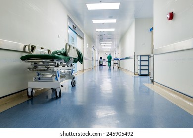 Doctors And Nurses Walking In Hospital Hallway, Blurred Motion. 