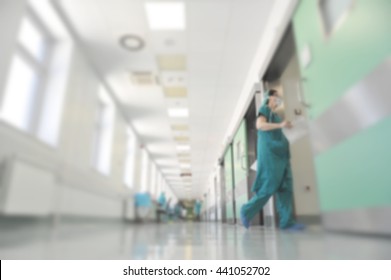 Doctors And Nurses Walking In Hospital Hallway, Blurred Motion.