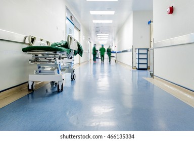 Doctors And Nurses Walking In Hospital Hallway, Blurred Motion. 