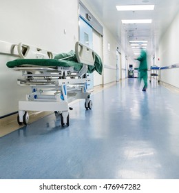 Doctors And Nurses Walking In Hospital Hallway, Blurred Motion. 