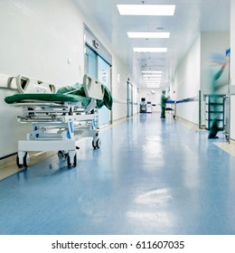 Doctors And Nurses Walking In Hospital Hallway, Blurred Motion. 