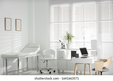 Doctor's office interior with modern workplace in clinic - Powered by Shutterstock