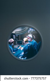 Doctors operating kneecap.