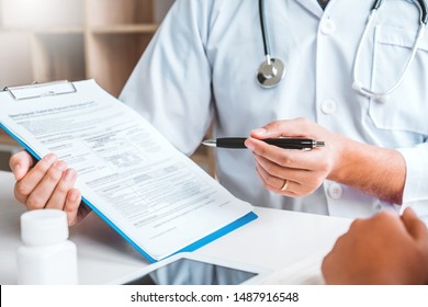 Doctors And Patients Consulting About Treatment Guidelines At Office