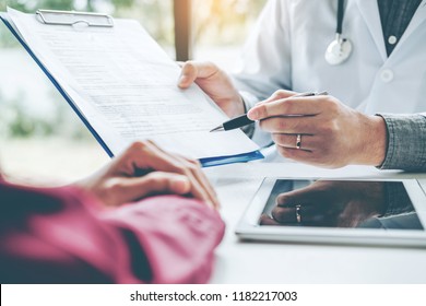 Doctors and patients sit and talk. At the table near the window in the hospital. - Powered by Shutterstock