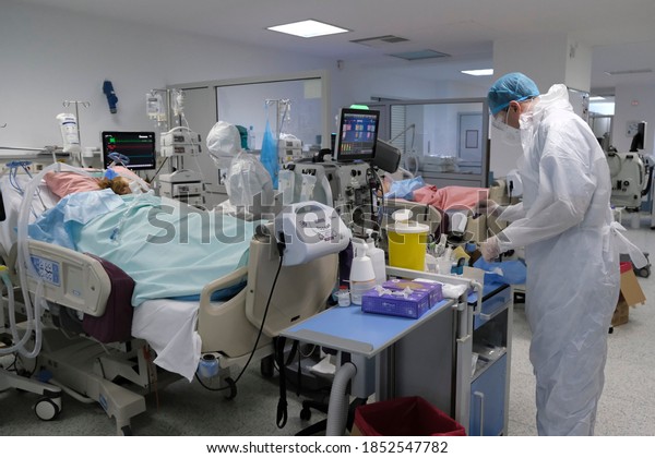 Doctors in the protective suits and masks at the\
intensive care unit for patients suffering from the coronavirus\
disease COVID-19 in Thoracic Diseases Hospital of Athens in Greece\
on November 8, 2020