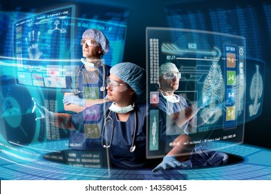 Doctors In A Research Station With Digital  Screens And Keyboard