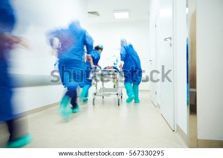 Doctors running for the surgery