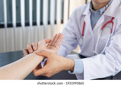 Doctors or specialists in the orthopedic section The patient's wrist is examined after physical therapy. And medical consultation for wrist injuries - Powered by Shutterstock