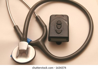 A Doctor's Stethoscope And Pager