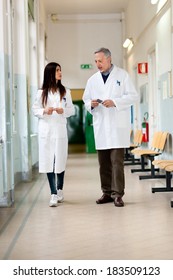 Doctors Talking In A Hospital Hallway