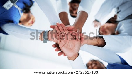 Doctors, team and stack hands in circle at hospital with support, motivation and celebration for goals. People, medical professional and group with low angle, synergy or healthcare services at clinic