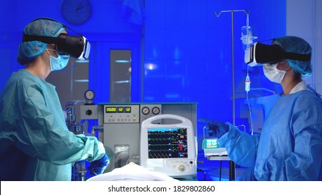 Doctors In VR Glasses Performing Surgery In Hospital