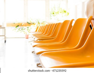 Doctor's Waiting Room With Chairs And Potted Plant