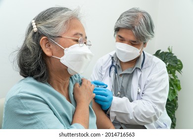 Doctors wear medical masks and vaccinated to senior women patients for the prevention of coronavirus and flu. Concept of immunization from inoculation - Shutterstock ID 2014716563