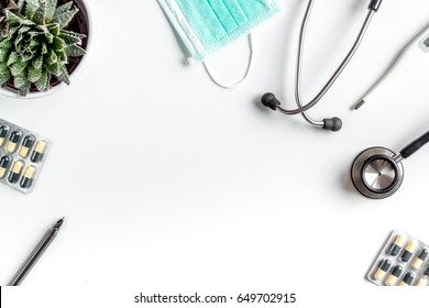 Doctor's Work Desk In Hospital With Stethoscope And Pills White Background Top View Mockup