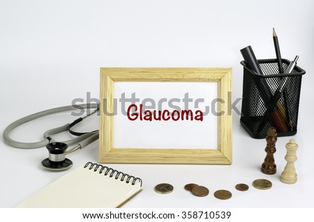 doctor's working table with the frame and the text - Glaucoma