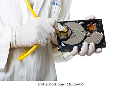 A Doctor/Technician Wearing A Lab Coat And Stethoscope Holding An Hard Disk