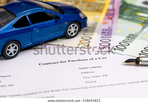 document - buying a car with euro, pen, calculator\
and toy car.