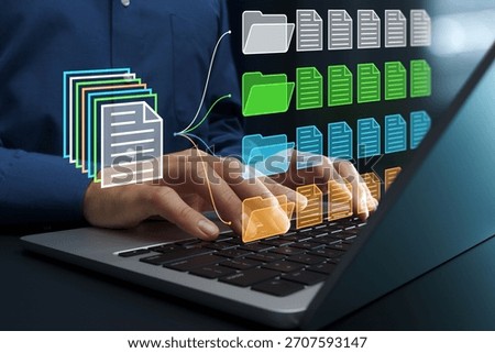 Document classification. Document management system DMS. File and folder icons. Businessperson using laptop computer for managing documents.