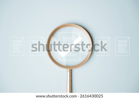 Document evaluation inspect. Contract agreement audit. Assessment survey evaluation check. A magnifying glass is being used to examine a piece of paper with a check mark on it.