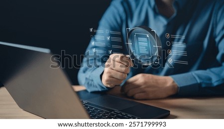 document, file, folder, management, report, information, finance, financial, insurance, search. A man is holding a magnifying glass over a laptop computer on file manager HUD.