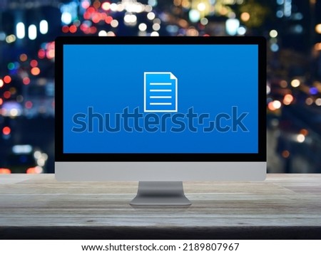 Document flat icon on desktop modern computer monitor screen on wooden table over blur colorful night light traffic jam road in city, Technology internet online concept