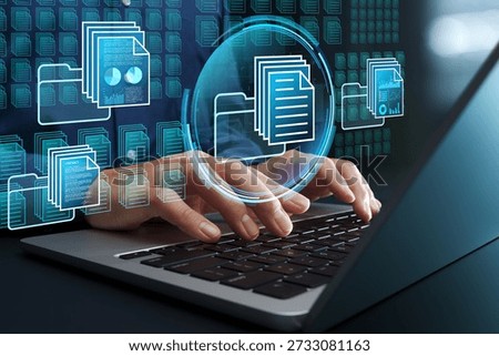Document and knowledge management systems. Automated text data classification. Businessman using laptop computer to access database.