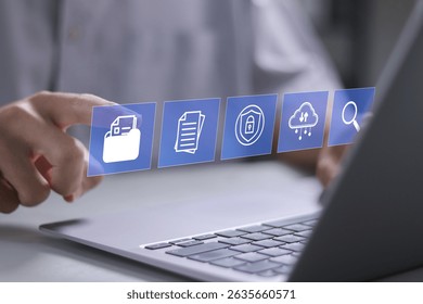 Document management concept. cloud storage, audit trails, security and search. Businessman using laptop document management system on virtual screen.